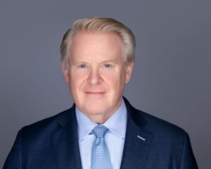 Headshot of a man dressed in a business suit